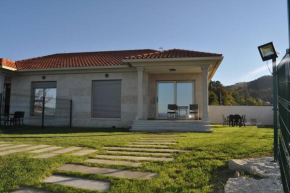 Отель Apartamento con Jardín en Areabrava  O Hío
